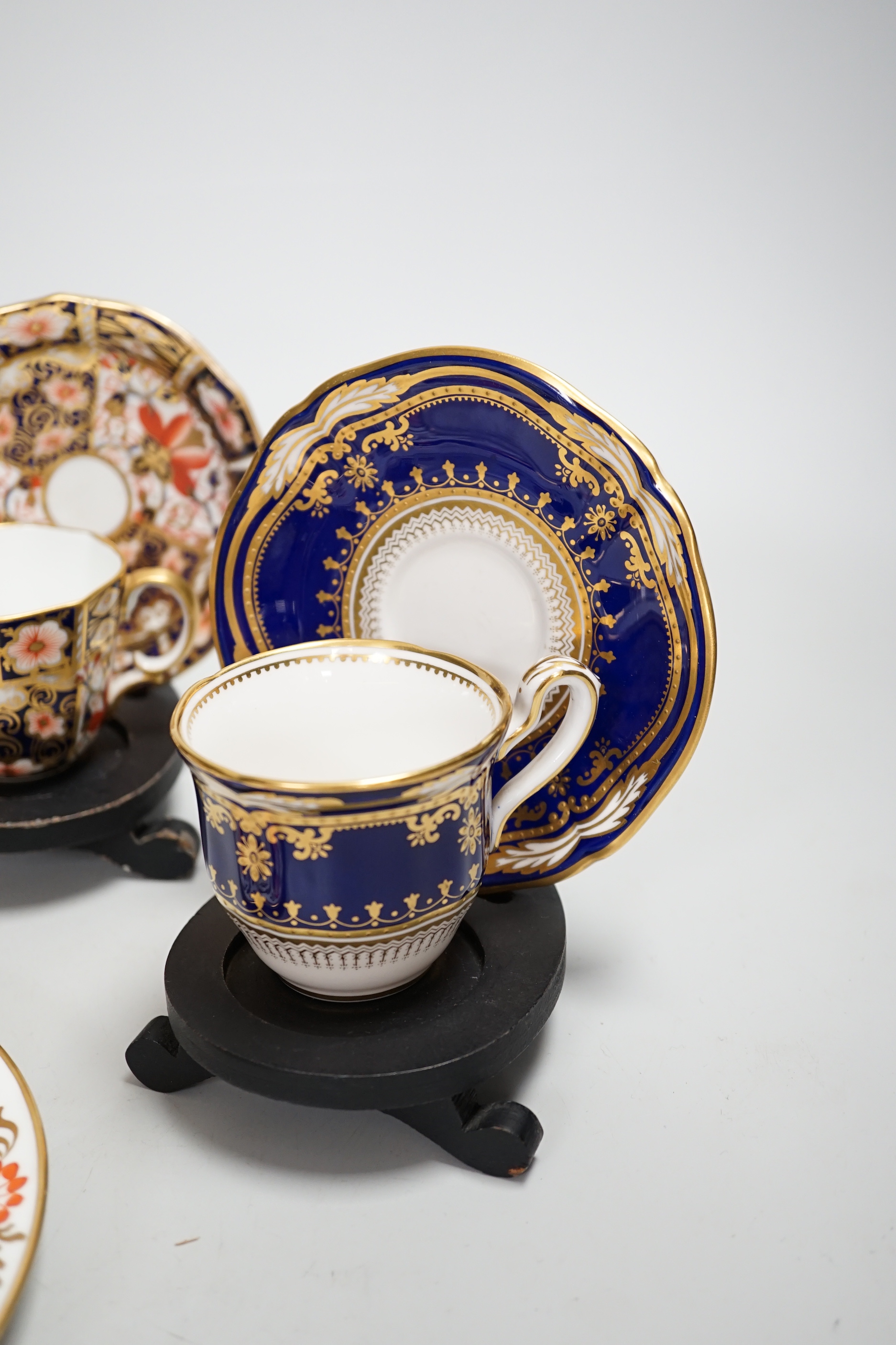 Three pairs of Royal Crown Derby porcelain cups and saucers, another Spode and a Victorian trio
